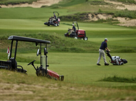 Toro mowers and a Workman on a golf course