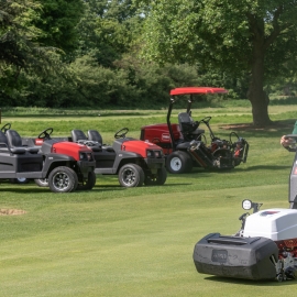 Course manager Ryan Bezzant operating the club’s new Greensmaster e1021, with the Reelmaster 5010-H and the two Workman GTX Lithium-Ion in the background.